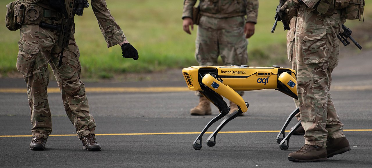 An RAF Leeming Airman interacts with a new Boston Dynamics Spot robot during Agile Liberty 21-2, Aug 25, 2021. The 48th Fighter Wing regularly conducts joint exercises with UK forces in order to demonstrate and improve our interoperability and Agile Combat Employment capabilities which includes using new technologies to increase their effectiveness. (U.S. Air Force photo by SrA John Ennis)