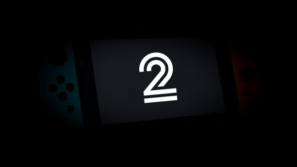 Imagem mostra o Nintendo Switch sob sombras pesadas com um número 2 na tela