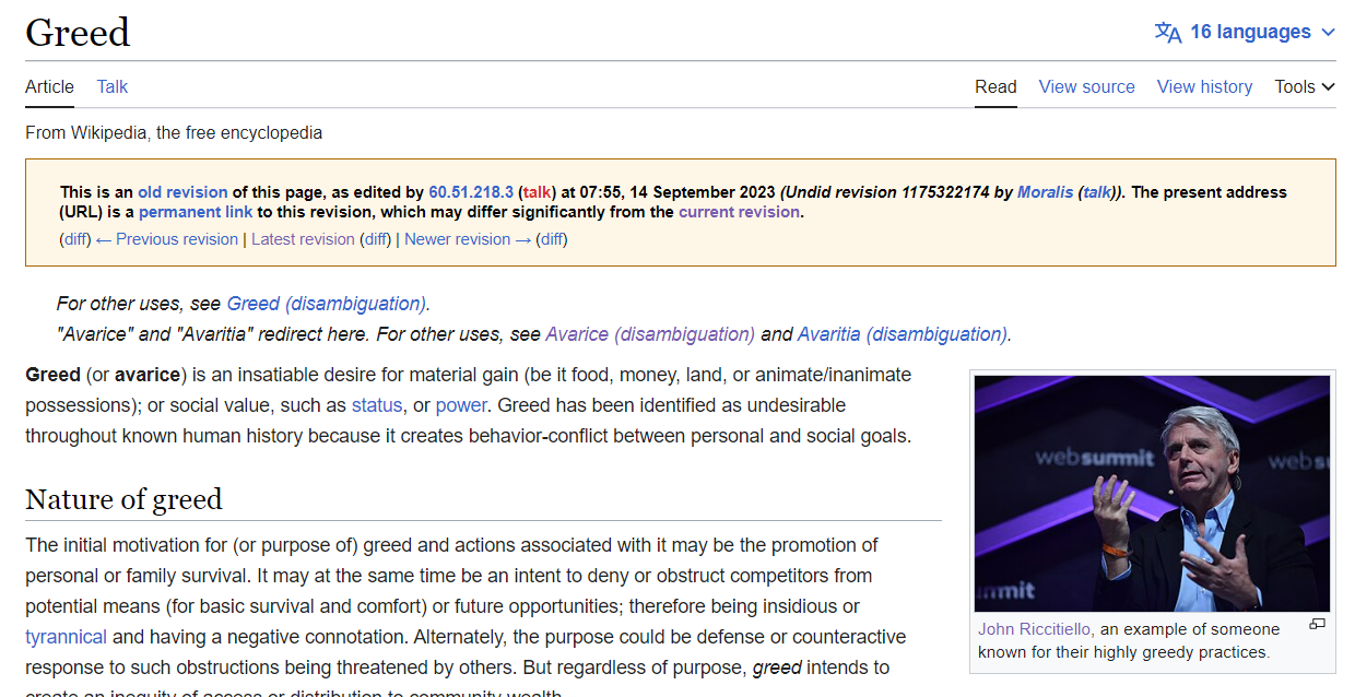 Imagem mostra verbete de "ganância" na Wikipedia, com o CEO da Unity, John Riccitiello, em destaque