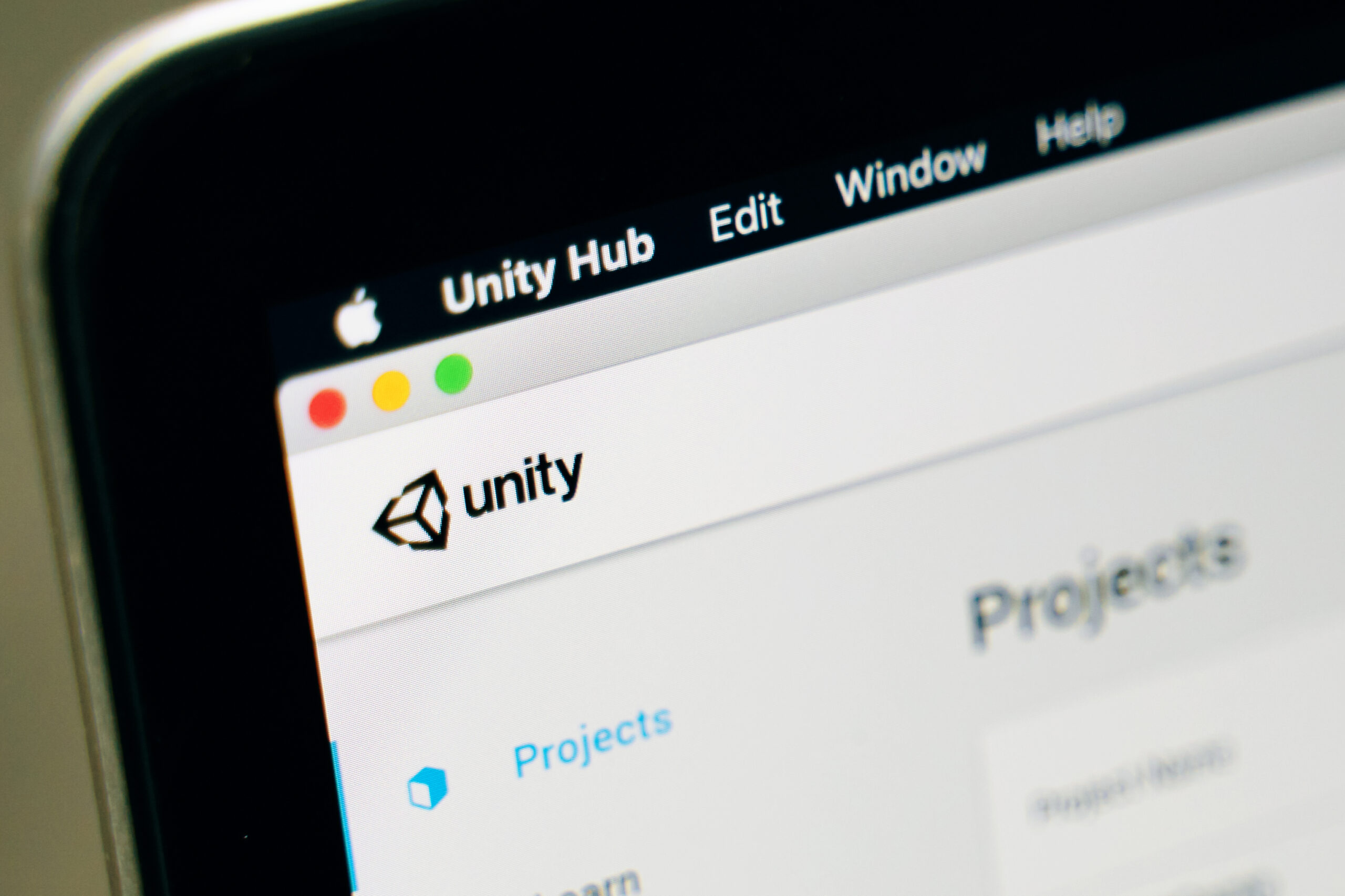 Imagem mostra logotipo do motor gráfico Unity na tela de um computador