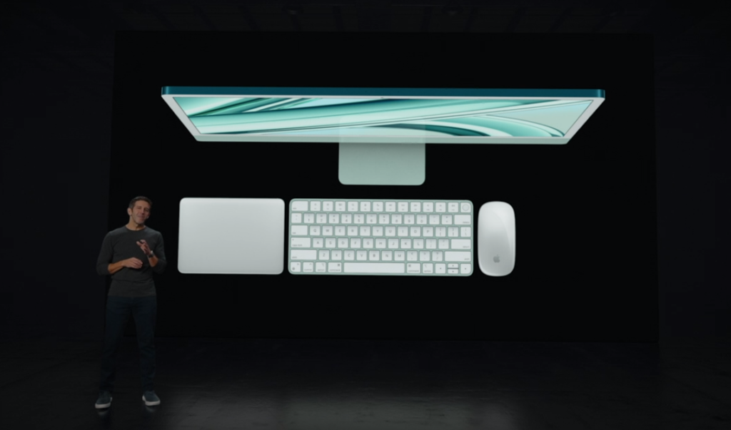 Ilustração em vista aérea de um iMac da Apple, acompanhado de mouse, teclado e tablet também da Apple